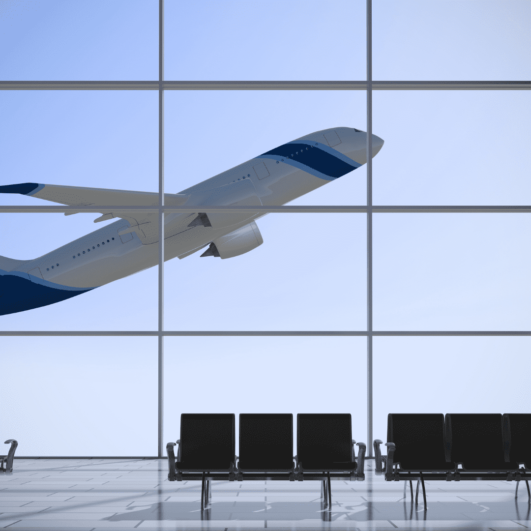 inside Stansted airport with a plane flying off