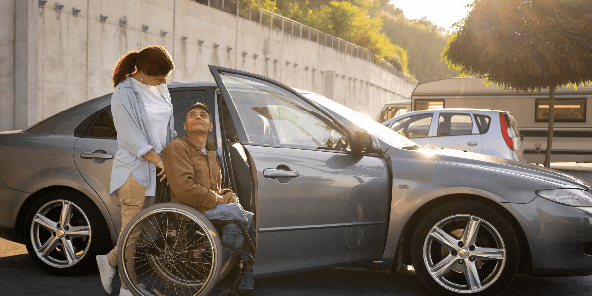 Lady with the man sitting on a wheel chair